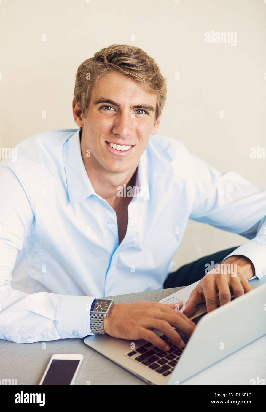 Young Professional, Handsome Man Working on Laptop Computer Stock Photo