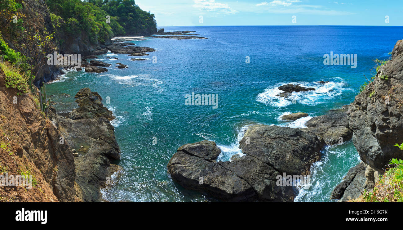 View from the top of some cliffs on Bahia Hermosa on the Papagayo Peninsula on the Pacific Coast of Costa Rica (panorama) Stock Photo