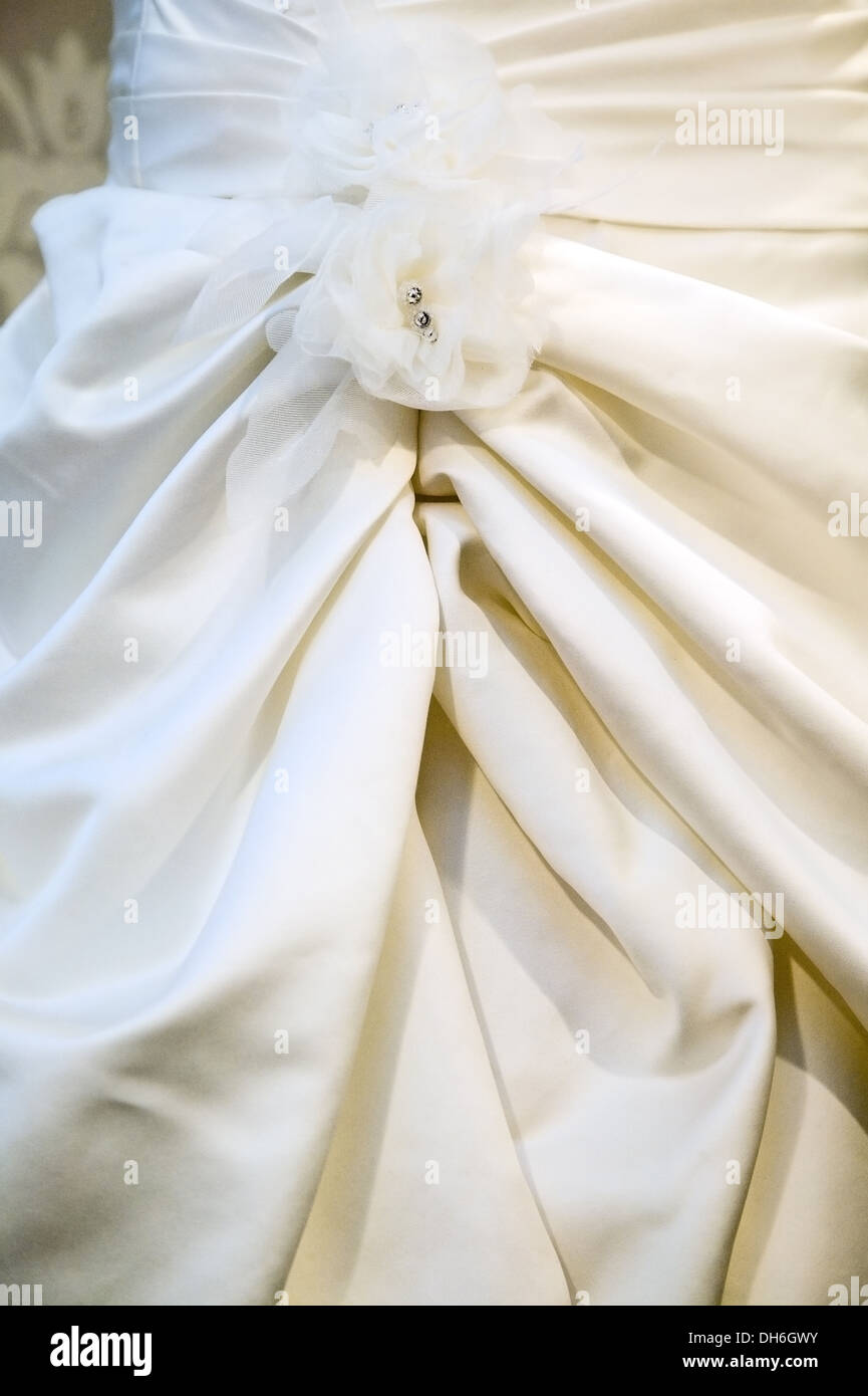 White ribbon enraged into evening dress, celebration concept Stock Photo