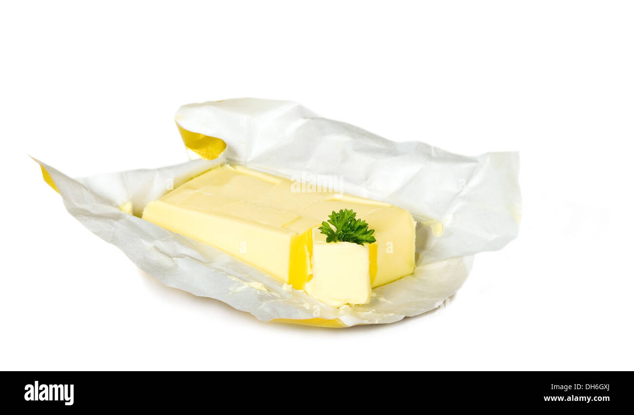 Yellow butter with paper package placed on isolated background Stock Photo