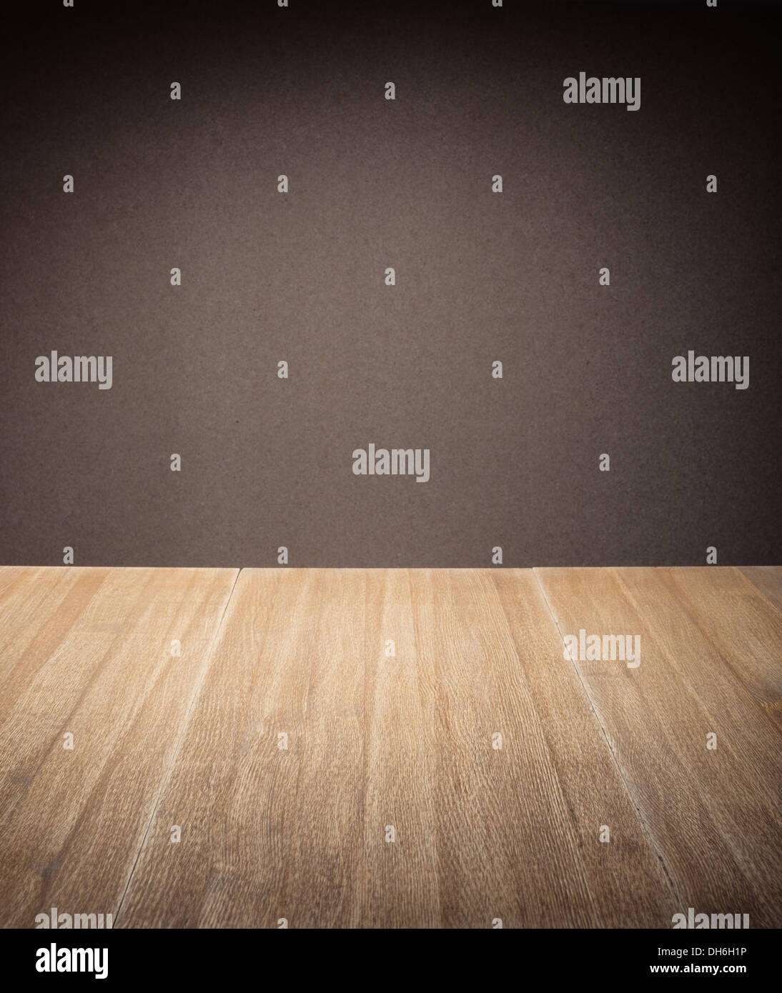 Wooden table in front of wall Stock Photo - Alamy
