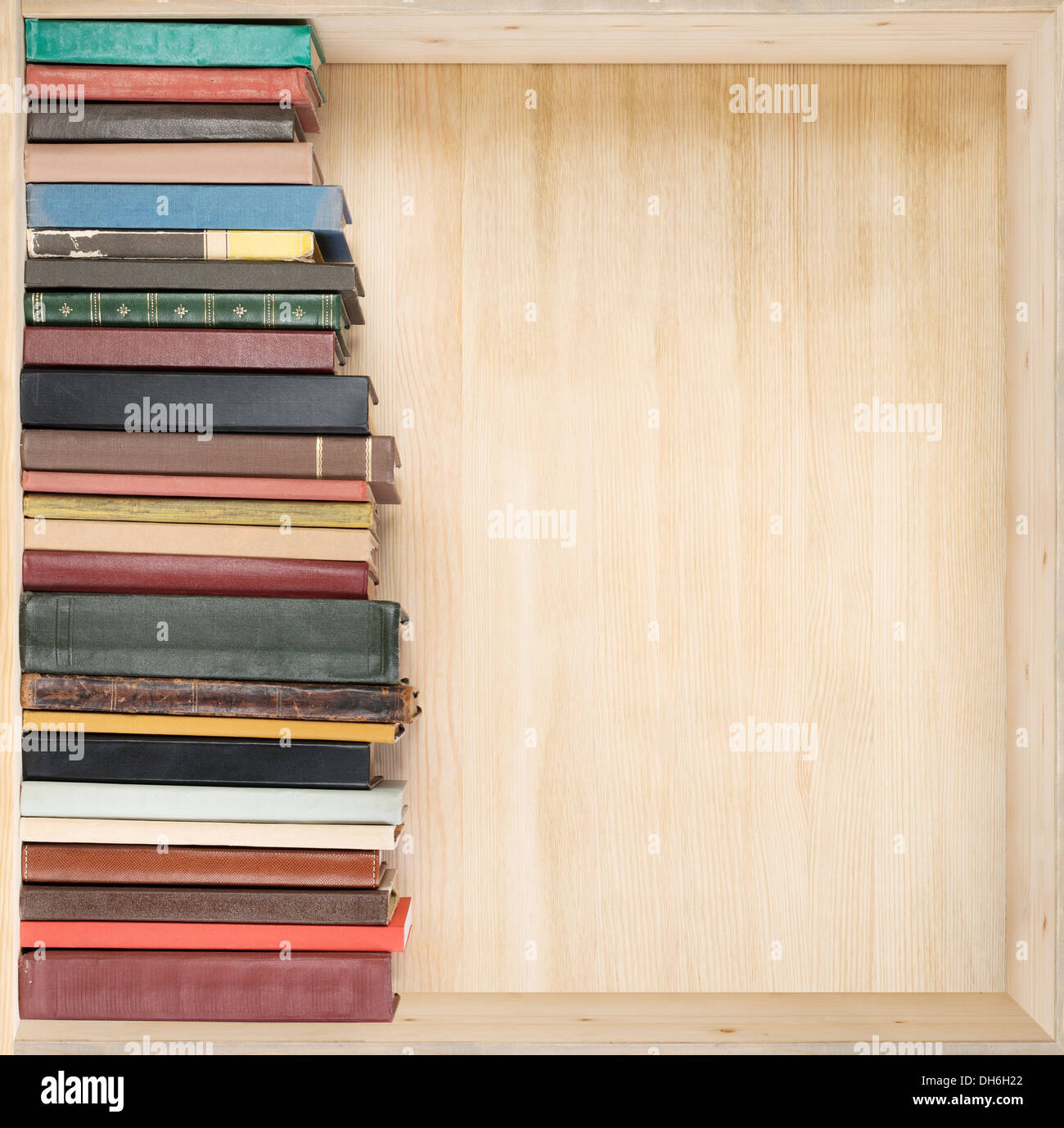 Old books on a wooden shelf Stock Photo - Alamy
