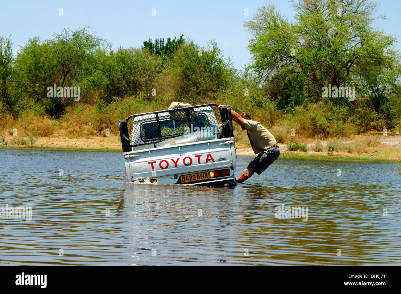 Four-wheel drive vehicule got stuck in the river, Okavango Delta, Botswana Stock Photo