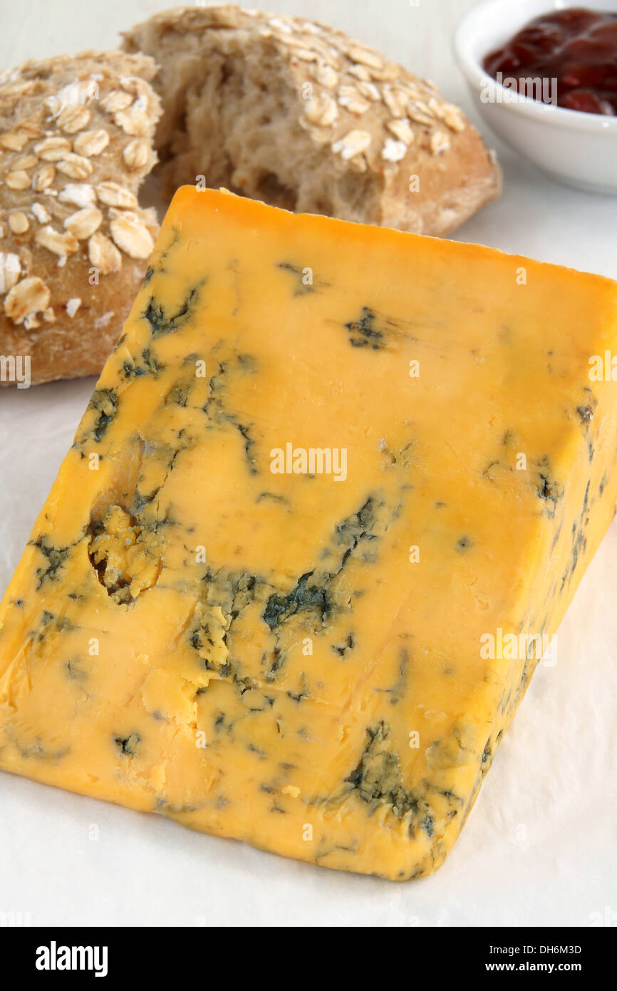 Shropshire Blue a creamy orange British blue cheese served with rustic bread and chutney Stock Photo