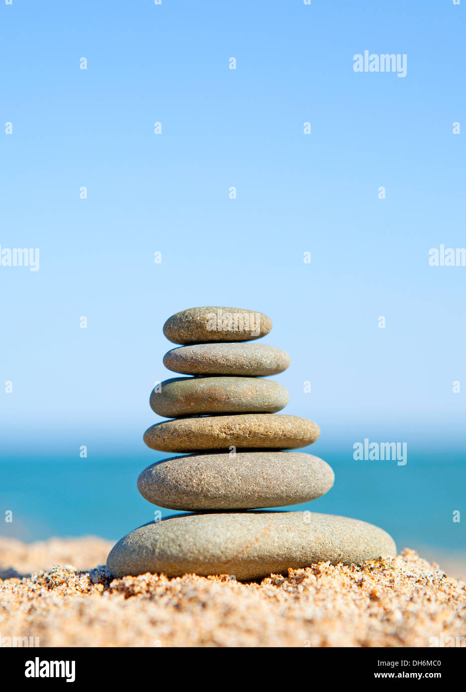 stack of zen stones near the ocean on sunny day Stock Photo