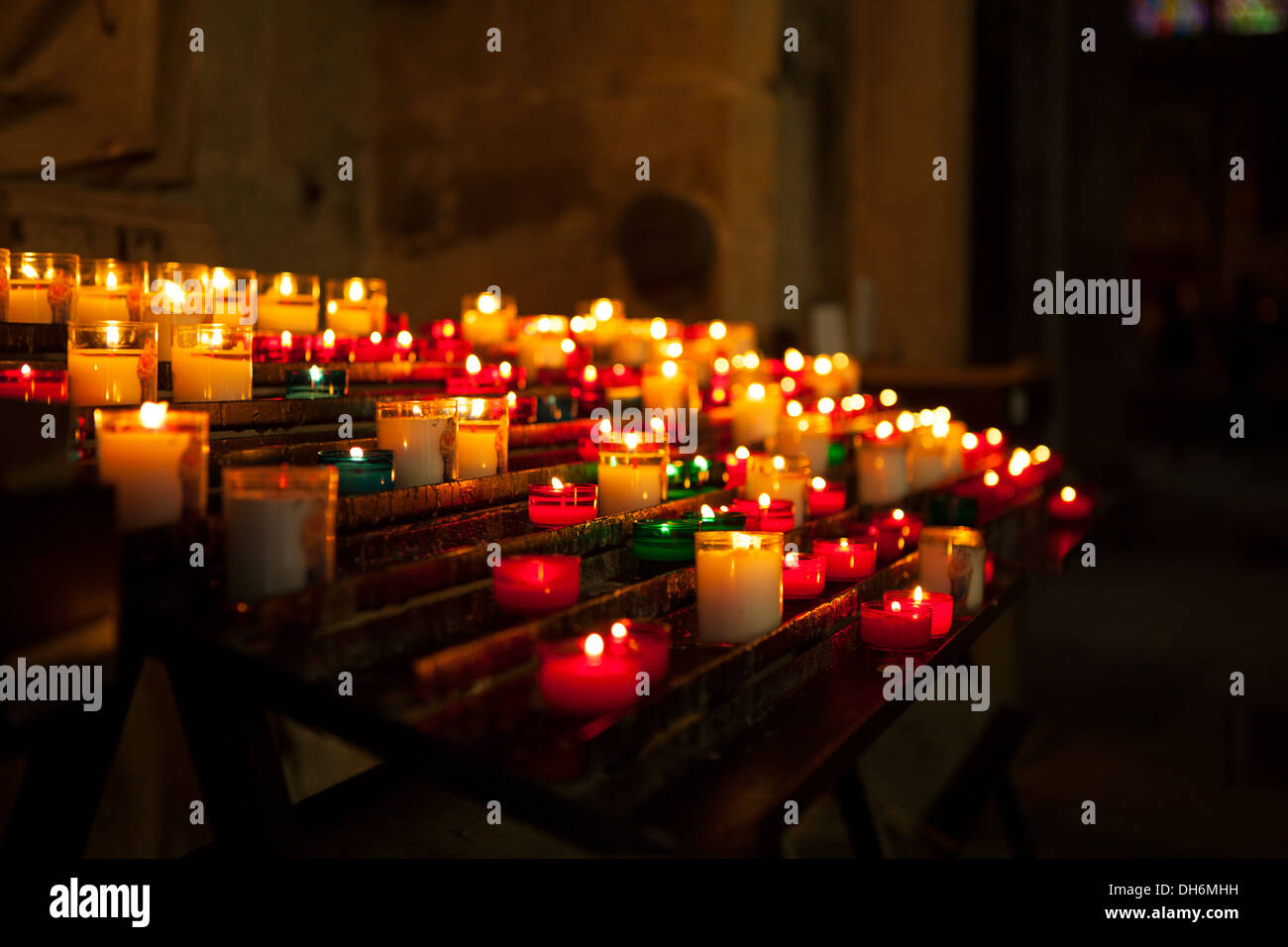 Candles in church burning for memorials Stock Photo Alamy