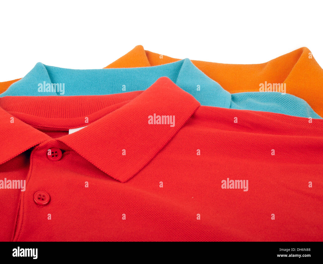 pile of man polo shirts isolated on white background Stock Photo - Alamy