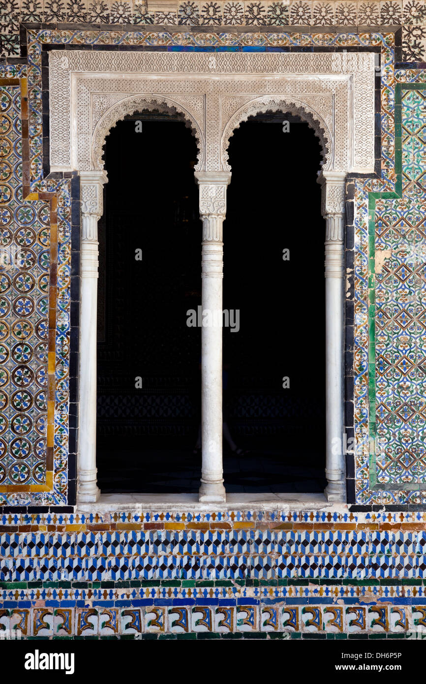 Arched window decorated in Mudéjar Spanish style at Casa de Pilatos in Seville, Spain Stock Photo