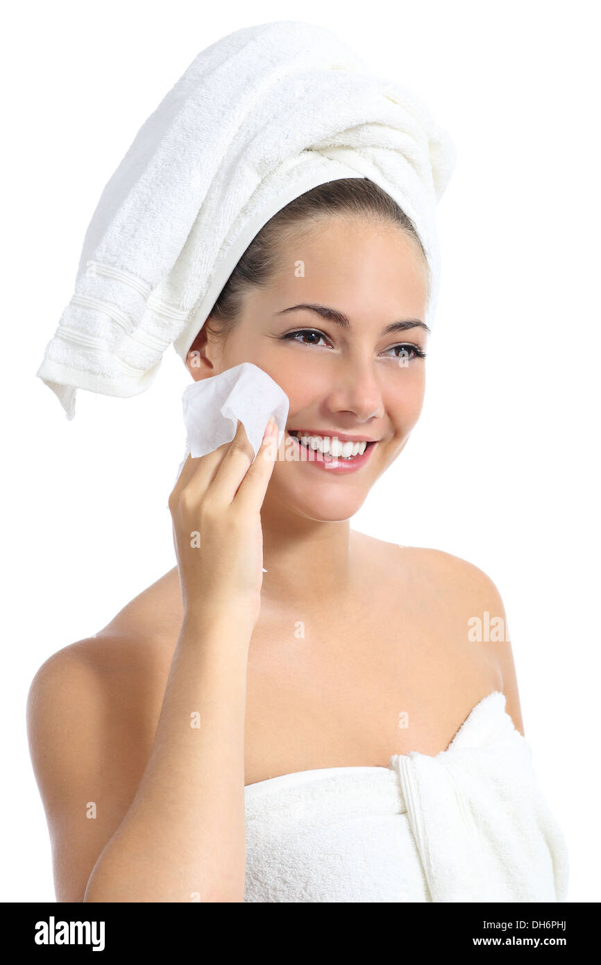 Beautiful woman cleaning her face with a baby wipe isolated on a white