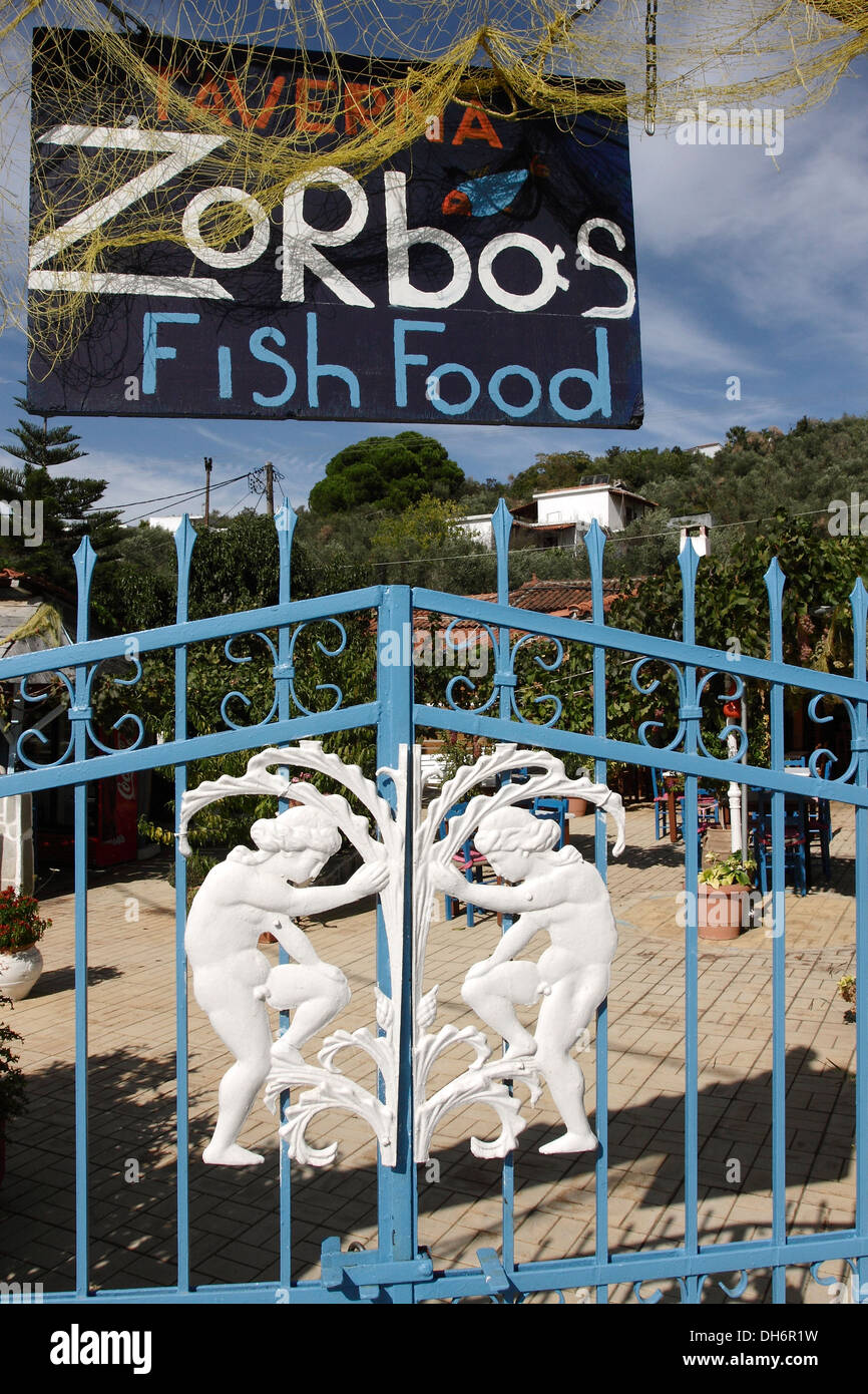 Ornamental gates leading into a fish Taverna on the Greek Island of Skiathos,a popular tourist destination in the Aegean Sea. Stock Photo