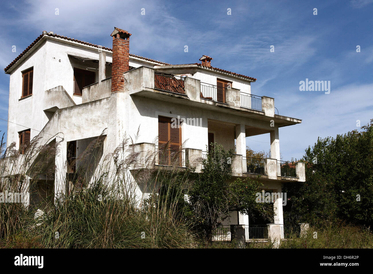 An empty property looking slightly run down on the Greek Island of Skiathos, a popular tourist destination in the Aegean Sea. Stock Photo