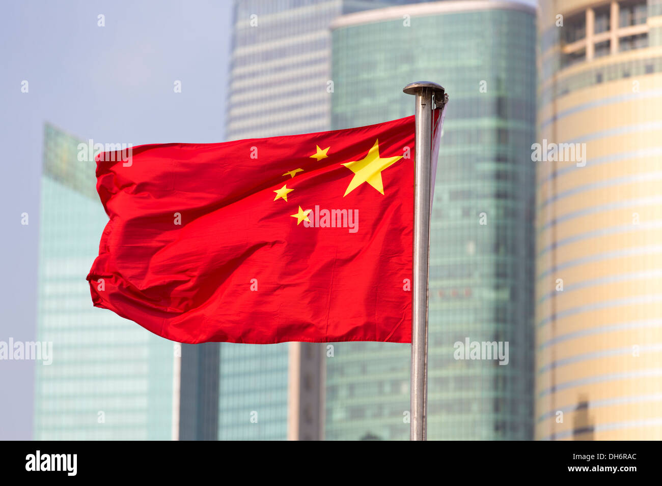 China's flag on the background of skyscrapers of Shanghai World Financial Center Stock Photo