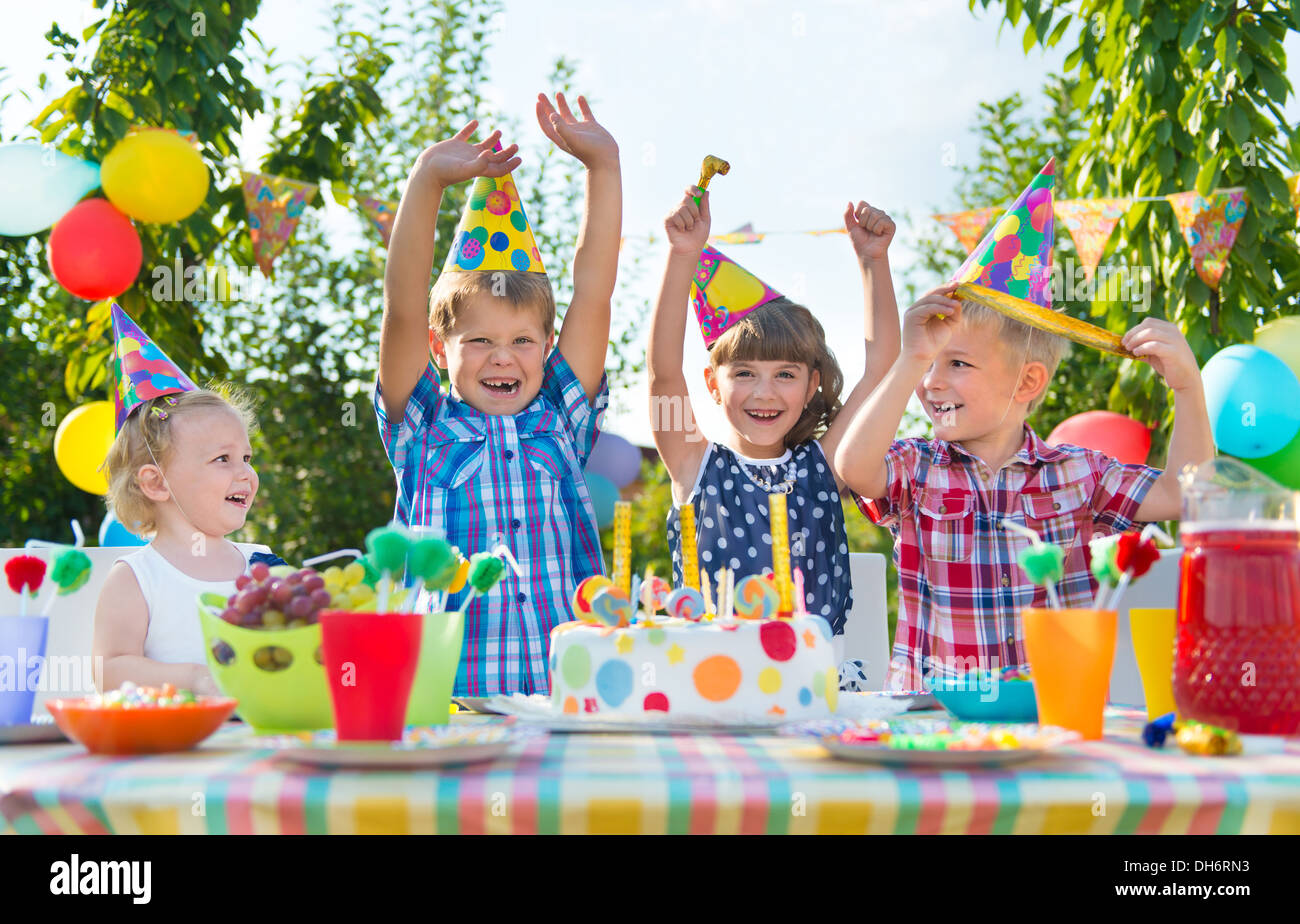 Group of adorable kids having fun at birthday party Stock Photo - Alamy