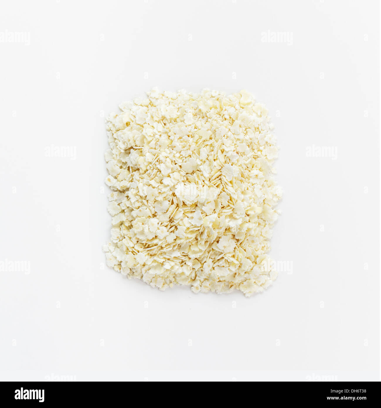 Millet flakes on white background Stock Photo - Alamy
