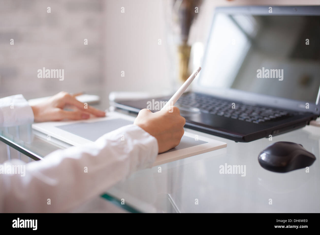Female designer using graphics pad in office Stock Photo Alamy