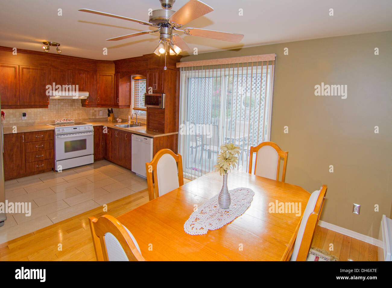 Modern Dining room with kitchen on the background Stock Photo - Alamy