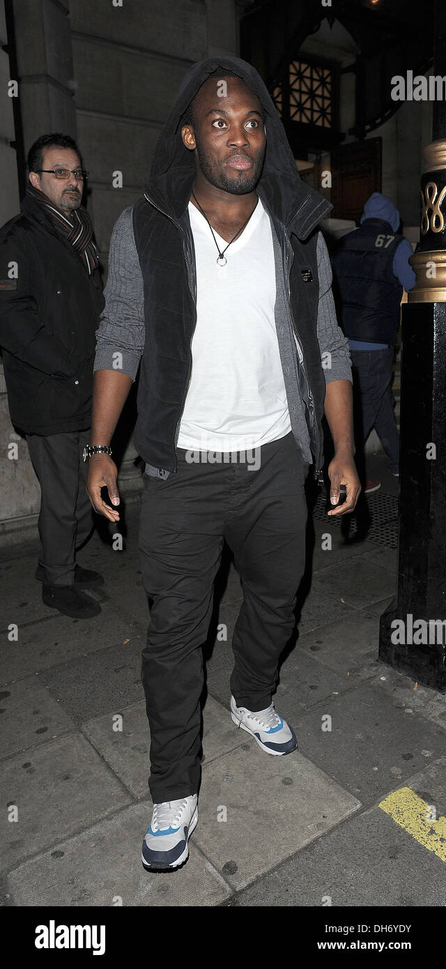 Chelsea FC footballer Michael Essien leaving Aura nightclub at 3.30am with other members of team following their 4-1 win over Stock Photo