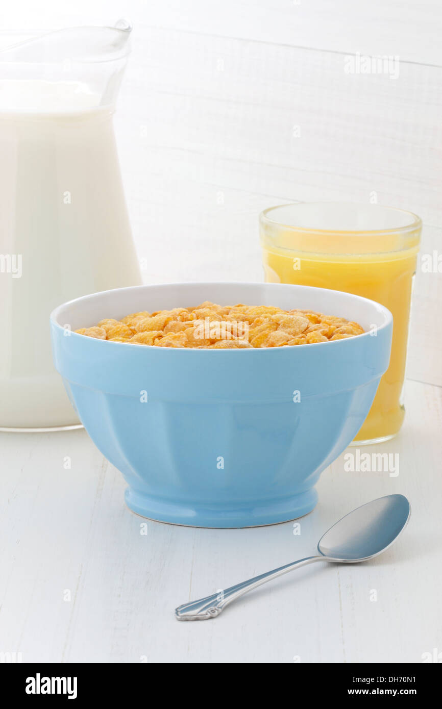 delicious and healthy corn flakes, with fresh milk and orange juice