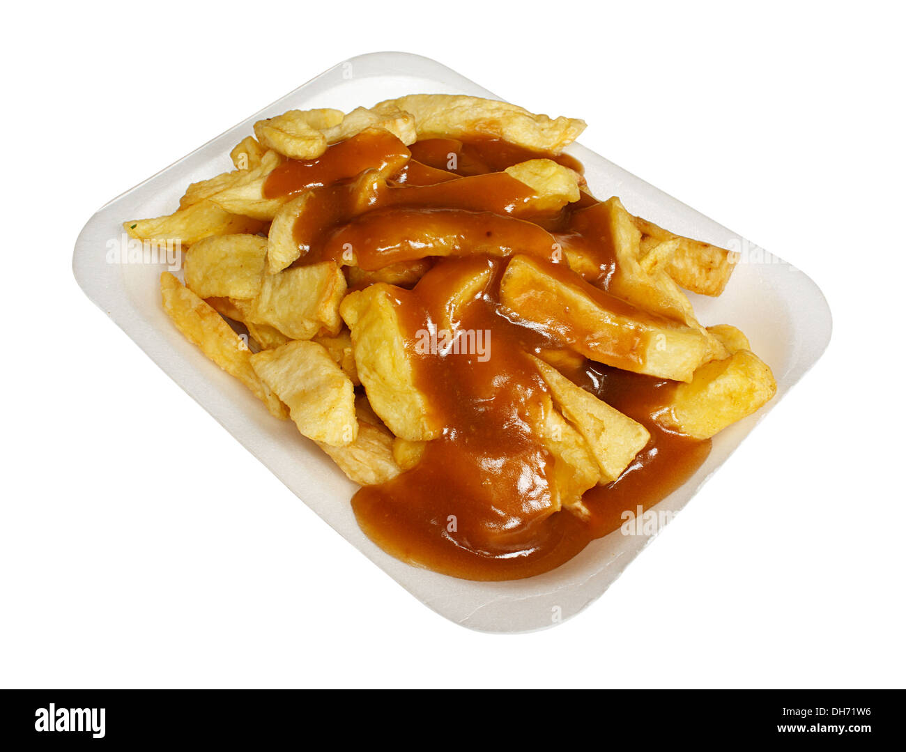 French Fries or Chips and gravy a popular european takeaway snack, served in a polystyrene tray from a take out. Stock Photo