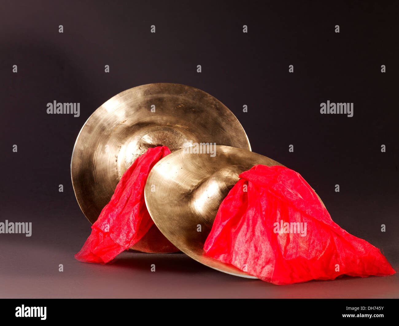 Chinese traditional musical instrument, a pair of cymbals with red cloth Stock Photo