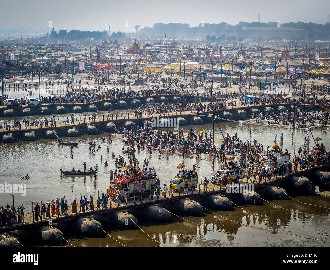 Thousands of Hindu devotees crossing pontoon bridges over the Ganges River at Kumbh Mela 2013 in Allahabad, India. Stock Photo