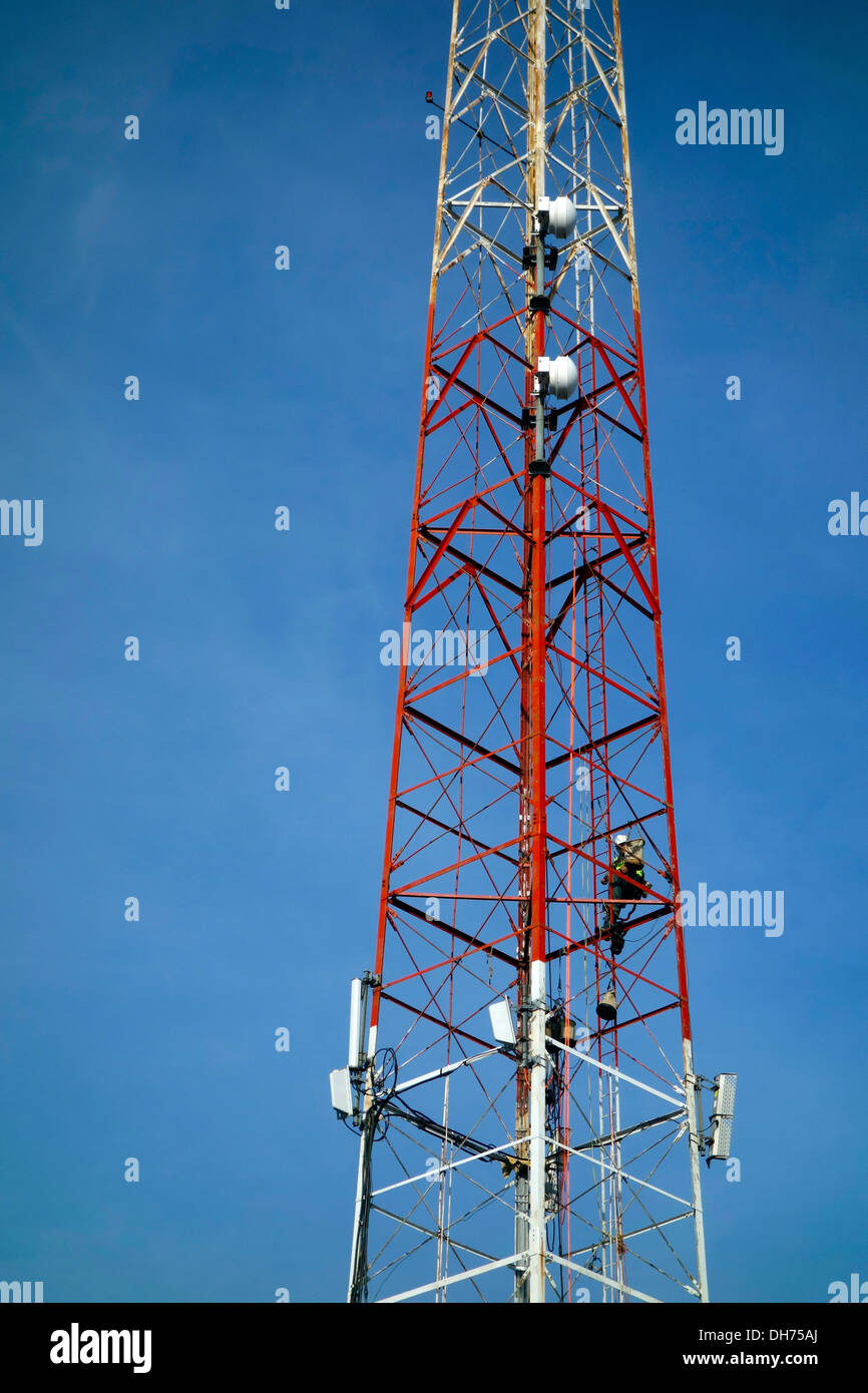 Man climbing communications tower hires stock photography and images