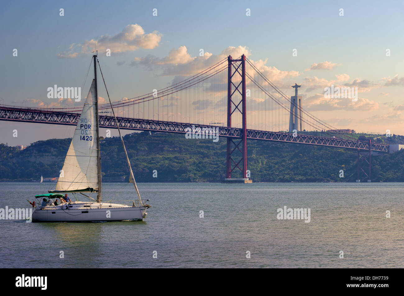 Portugal, Lisbon, the Cristo Rei monument and the Ponte 25 de Abril bridge at dusk Stock Photo