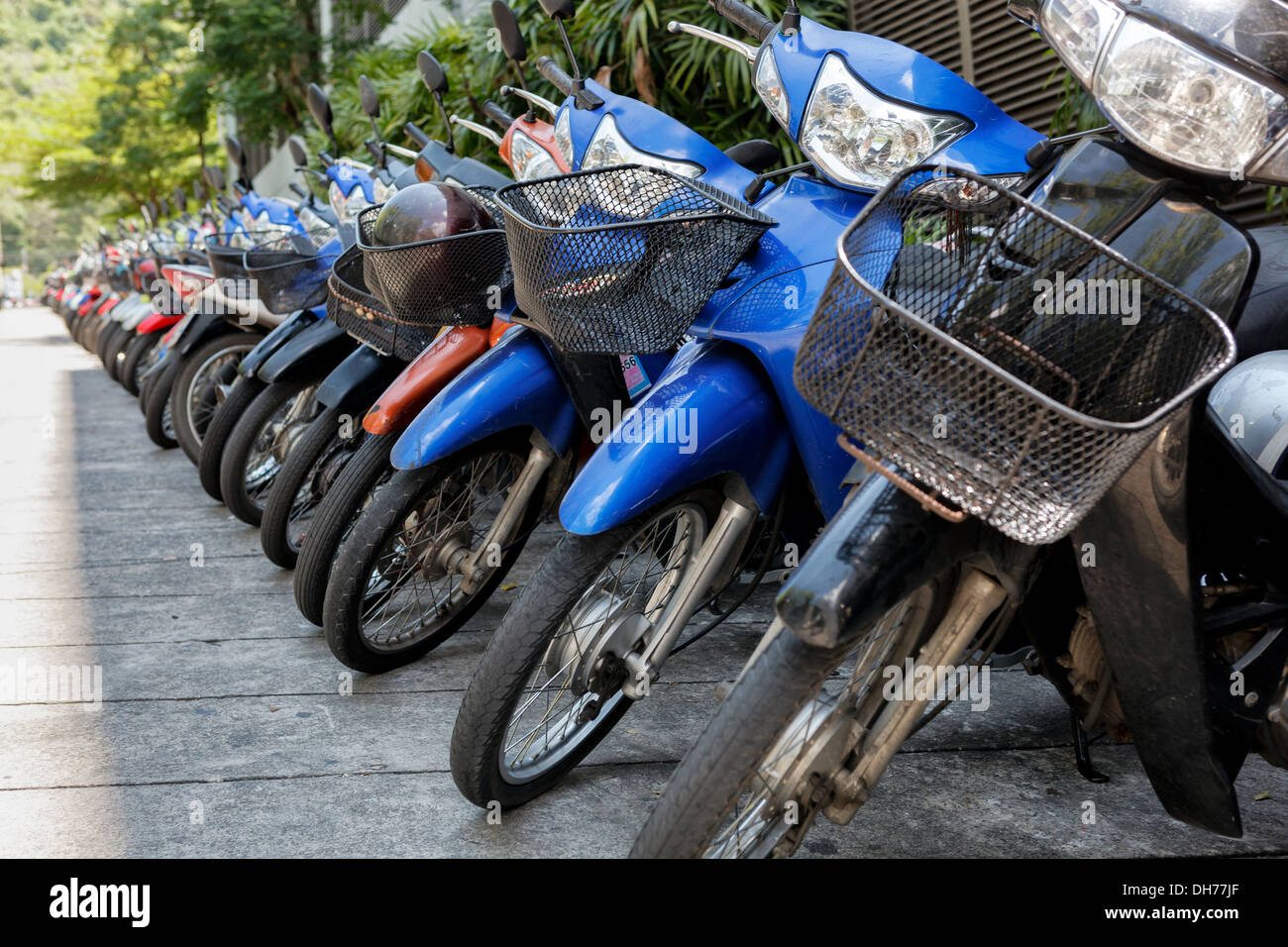 Many motorbikes at the parking near big store Stock Photo