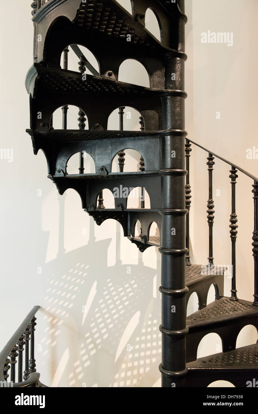 Cast iron spiral staircase and shadow in the State Library of Victoria. Stock Photo