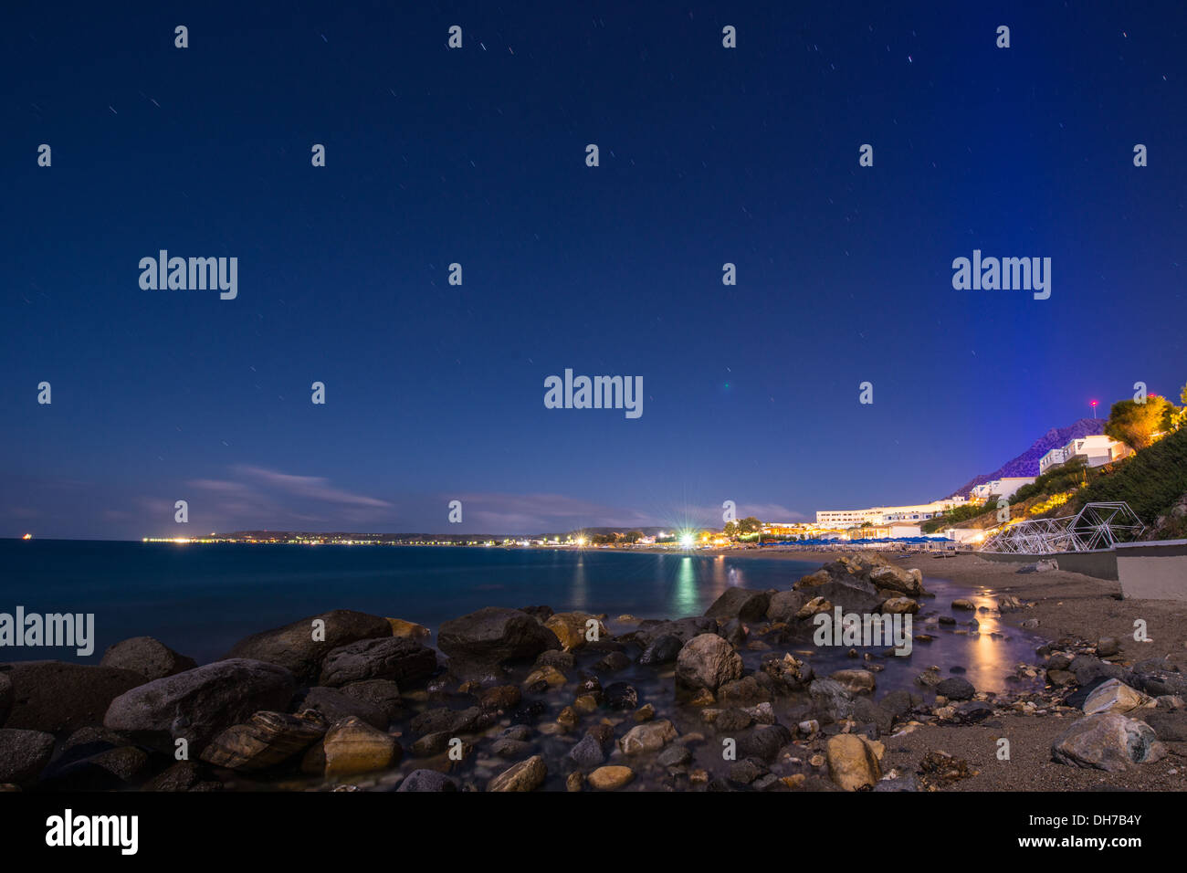 Mitsis Summer Palace hotel beach in Kos Greece lighted by the moon on  a autumn evening Stock Photo