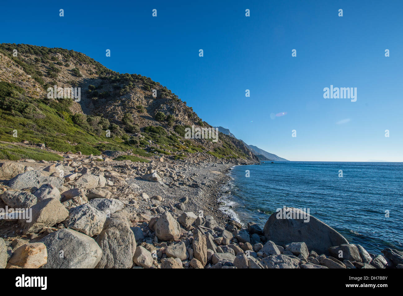 The rocky beach of Kardamena Kos near the Mitisis Summer palace Stock Photo
