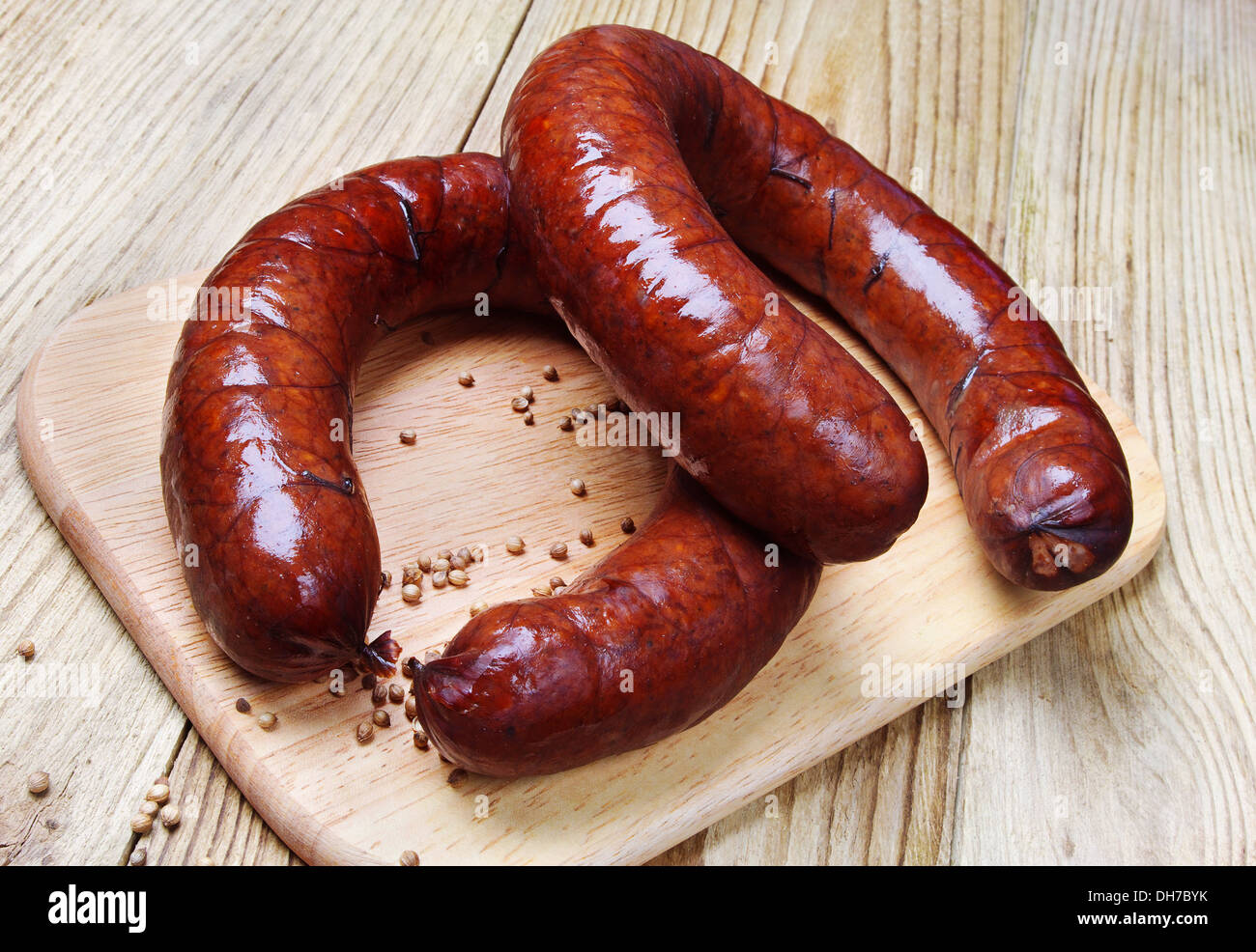 Homemade smoked sausage on a cutting board Stock Photo