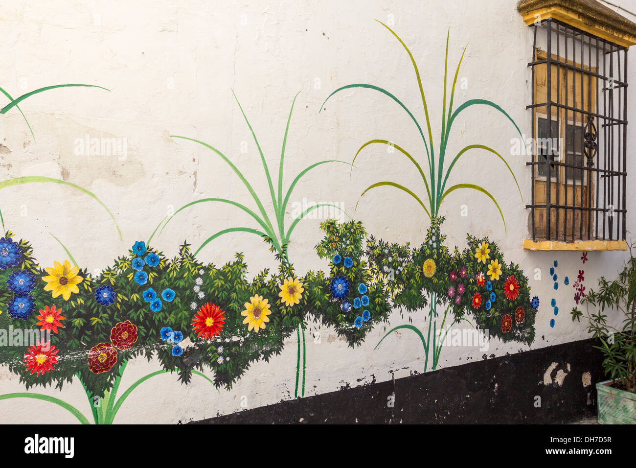 COLOURFUL MURAL OF FLOWERS PAINTED ON A WALL IN THE OLD TOWN OF MARBELLA SPAIN Stock Photo