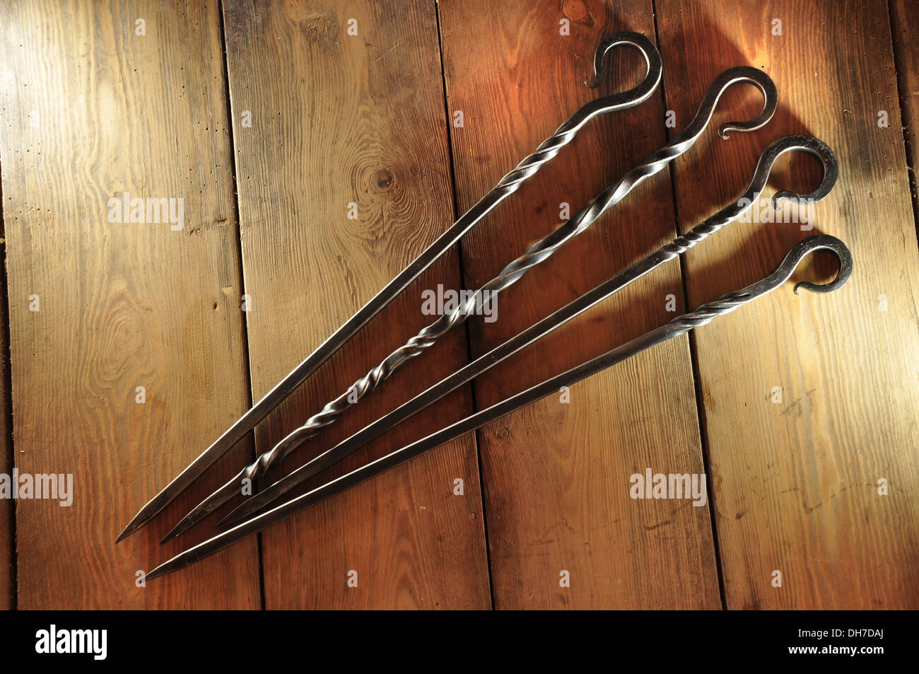 Four iron fire pokers UK Stock Photo Alamy