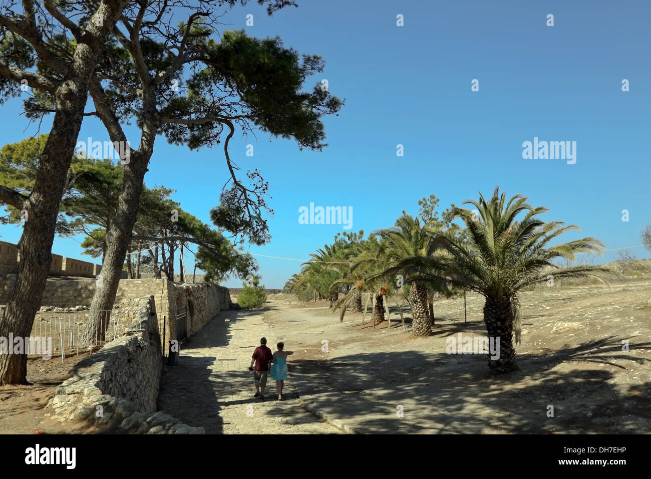 Tourists sightseeing within the enclosure of  the The Fortezza, The Venetian Fortress of Rethymno, Palekastro, Crete, Greece. Stock Photo