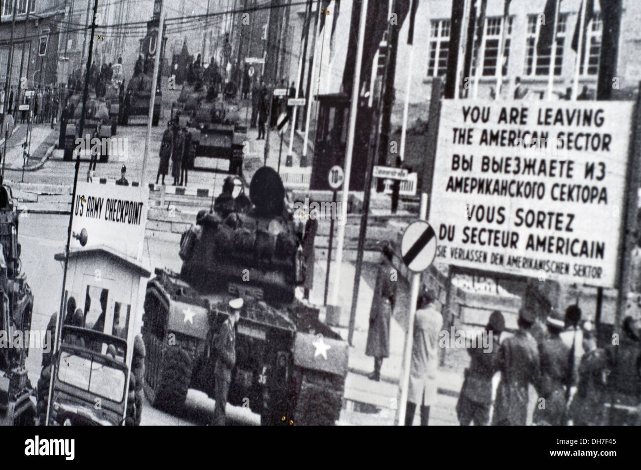 Historic image of Checkpoint Charlie which is part of a large outdoor display close to the famous landmark in Berlin, Germany Stock Photo
