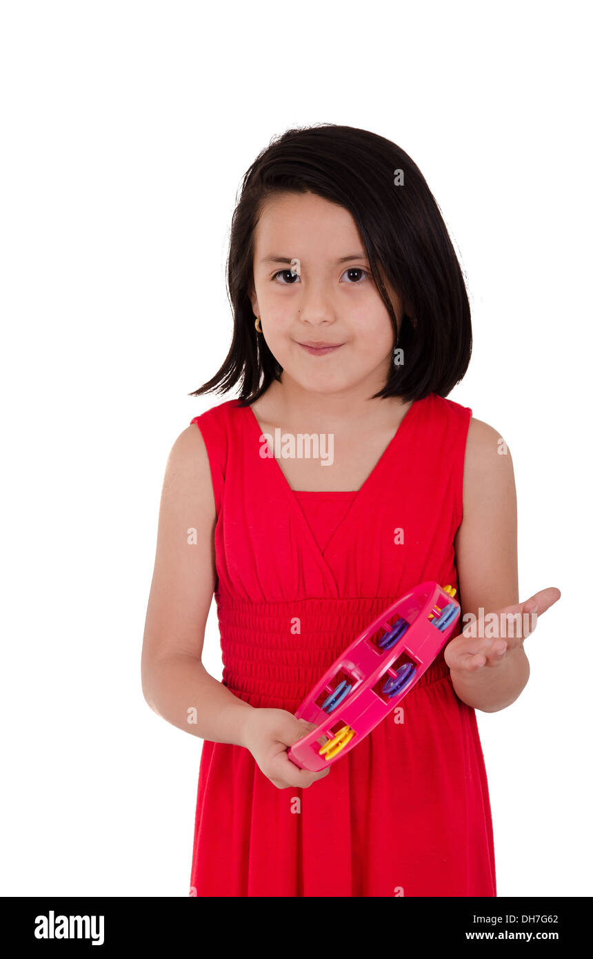 Young girl making music with tambourine on white background Stock Photo