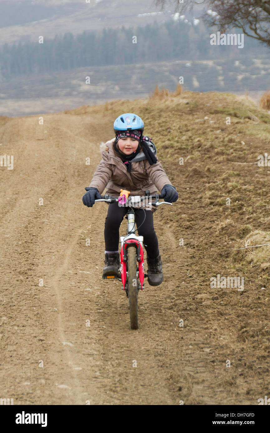 Girl mountain biking Stock Photo