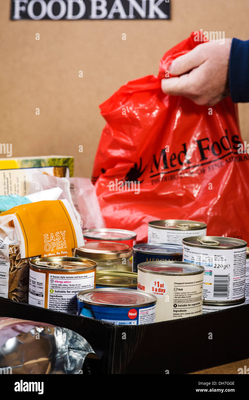 Preparing a food box at a food bank Stock Photo Alamy