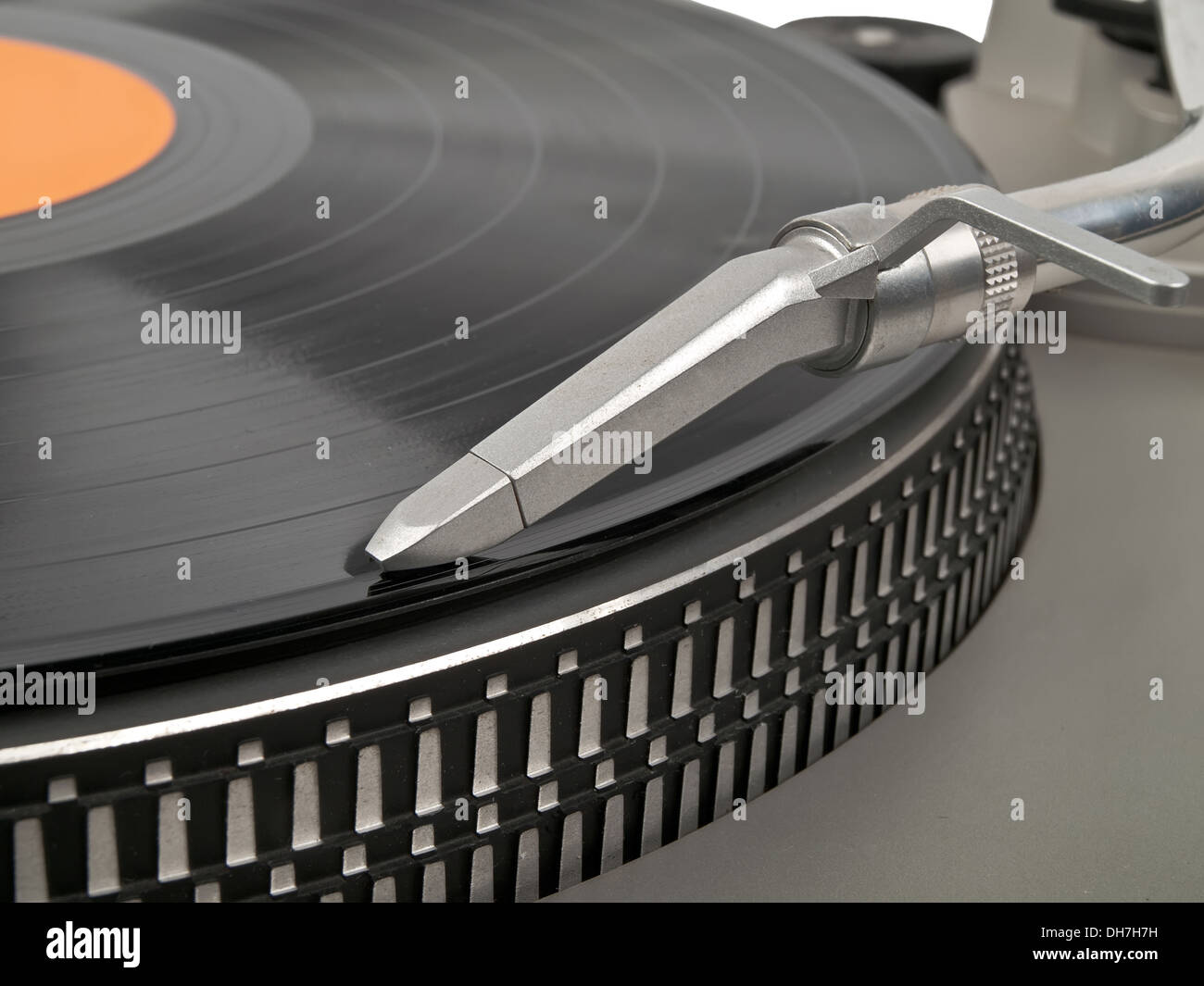record playing on turntable and cartridge in front view Stock Photo