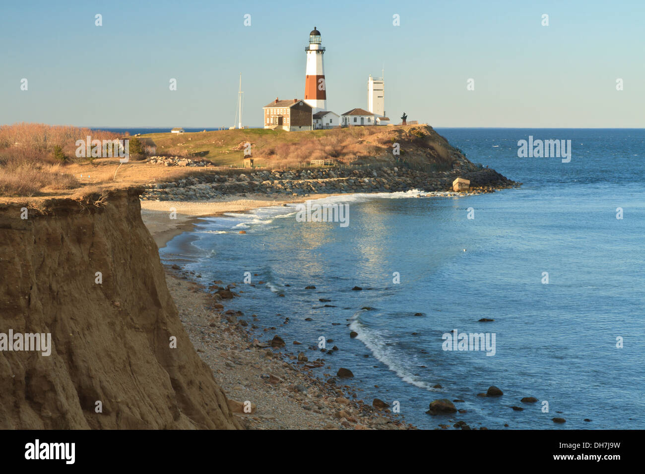 Montauk Lighthouse with an eroding bluff in the foreground on the Eastern tip of Long Island, New York Stock Photo