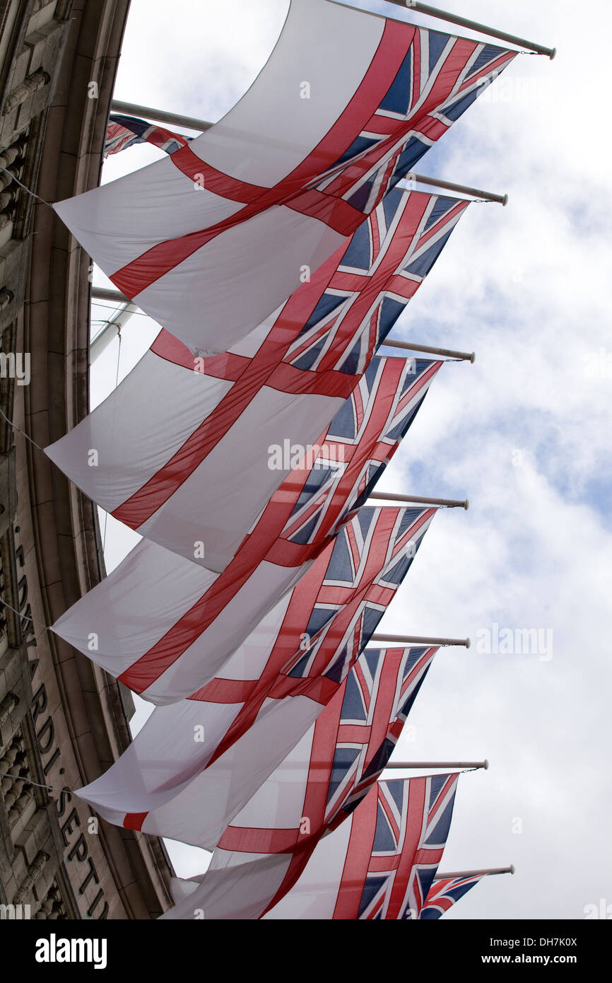 White Ensign Royal Navy maritime flags flying from Admiralty Arch in London Stock Photo