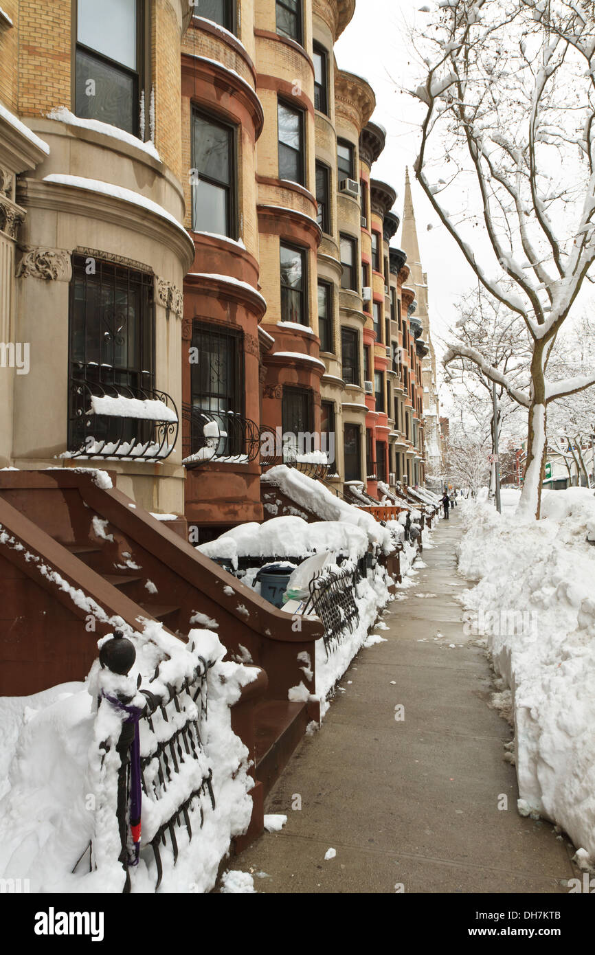 A block of rounded Brownstone apartments in the Park Slope neighborhood of Brooklyn, NY after January 2011 snowstorm. Stock Photo