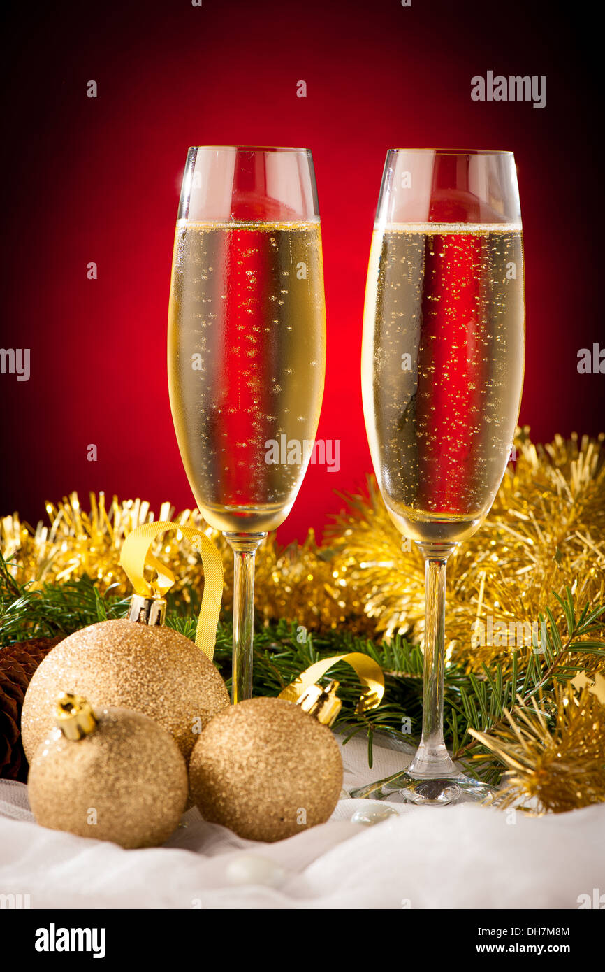 Two glasses of sparkling wine on christmas and new year decoration arrangement background Stock Photo