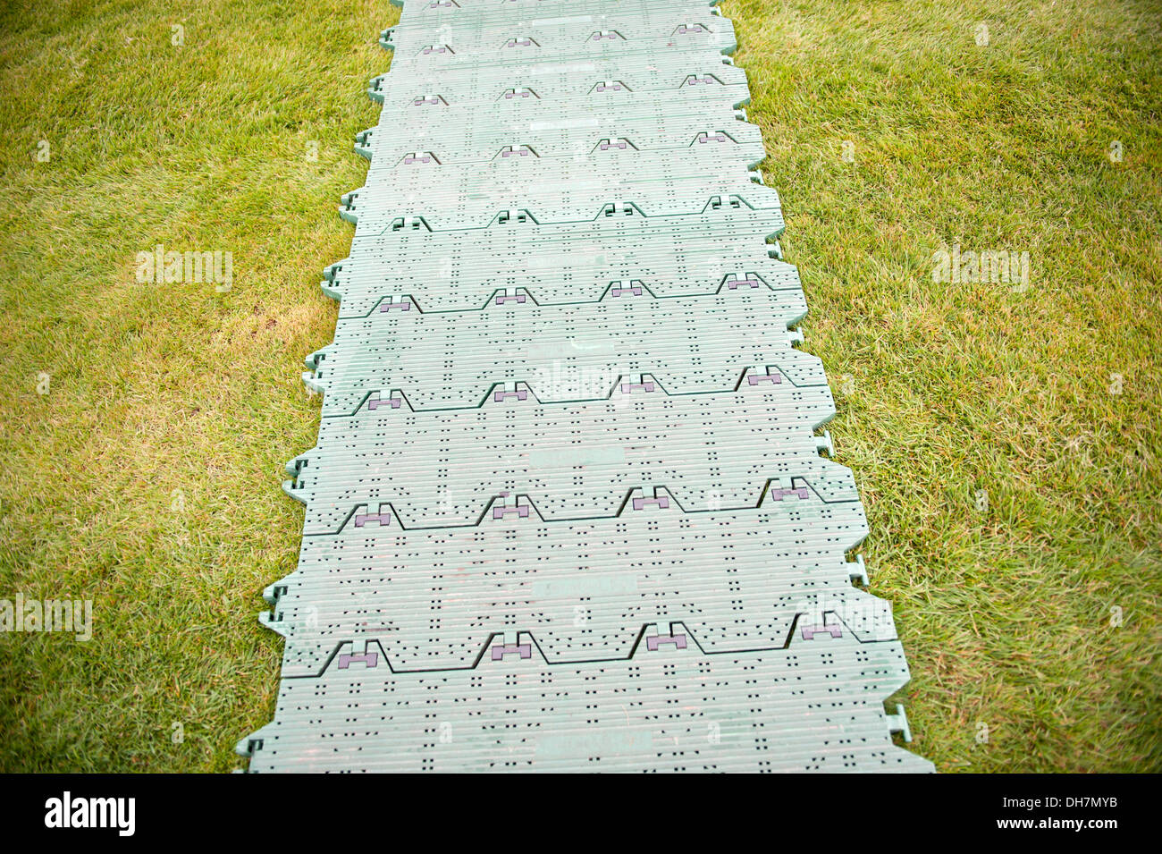 Temporary Walkway plastic protect grass wet mud damage Stock Photo