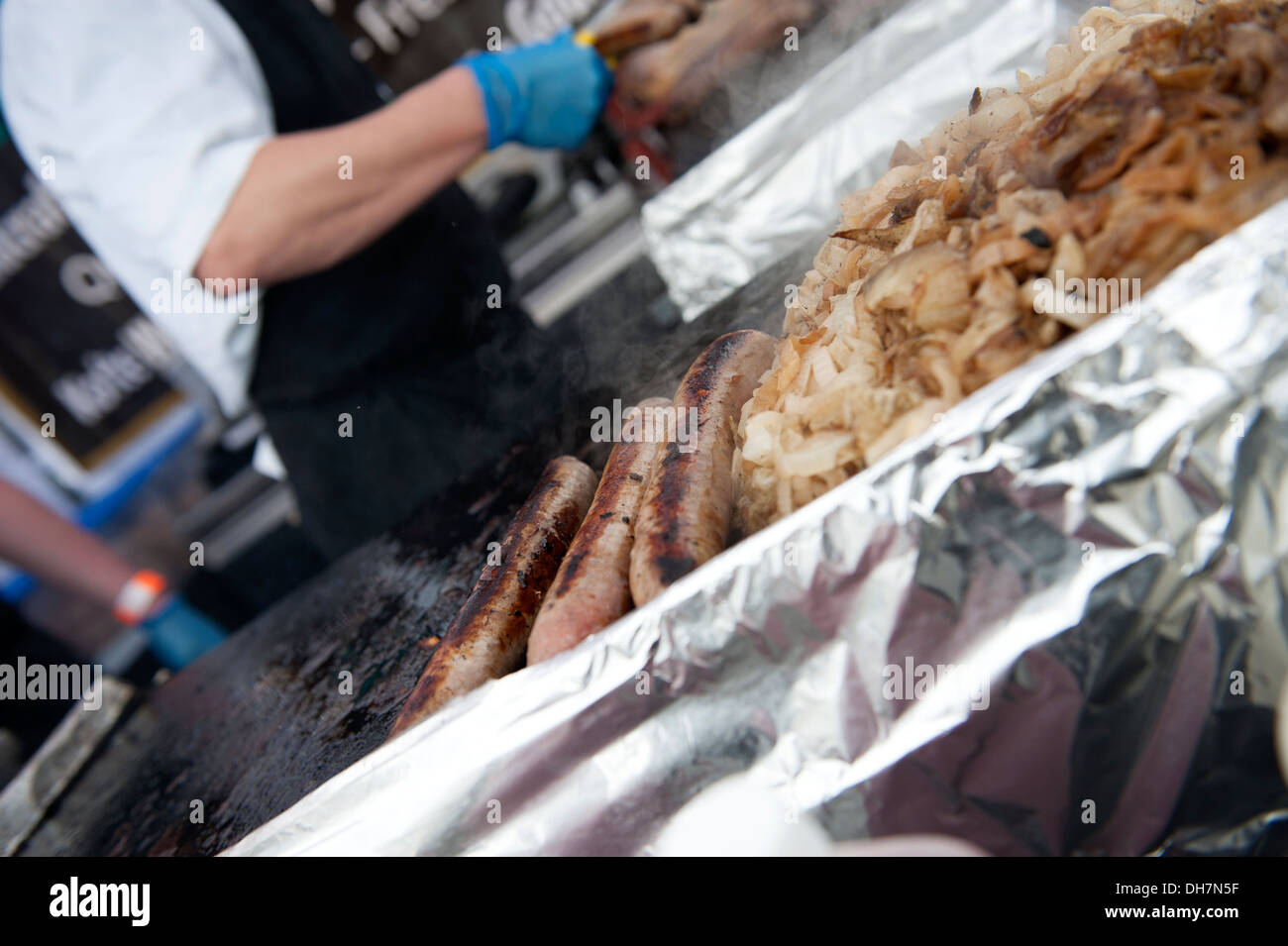 Hotdog Sausages and Onions Cooking Cooked Outdoor Food Stock Photo