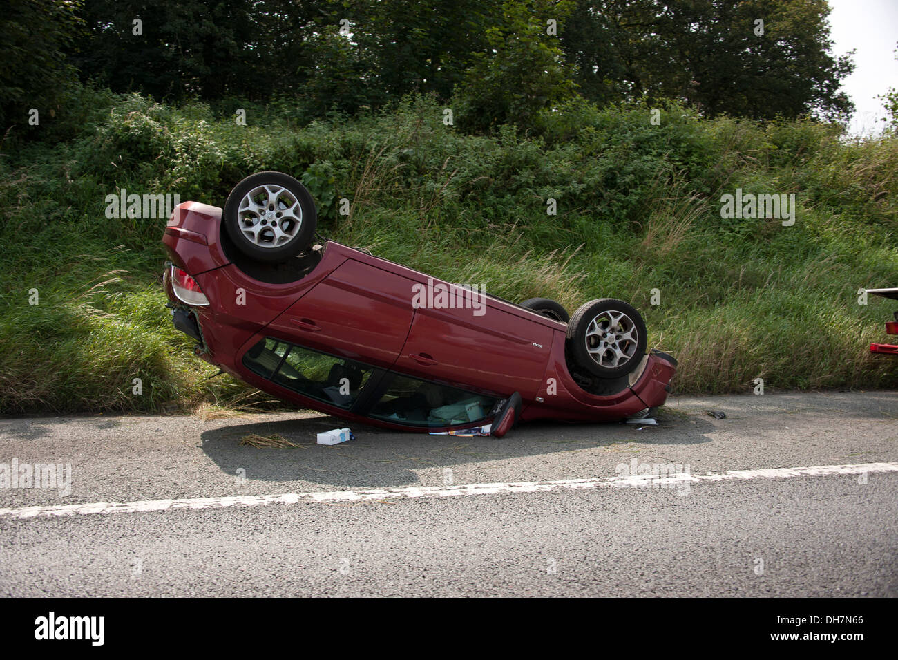 Crashed car upside down on roof RTA RTC Stock Photo