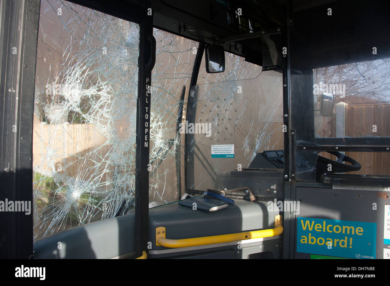 Smashed windscreen on PSV bus vandalised vandal Stock Photo