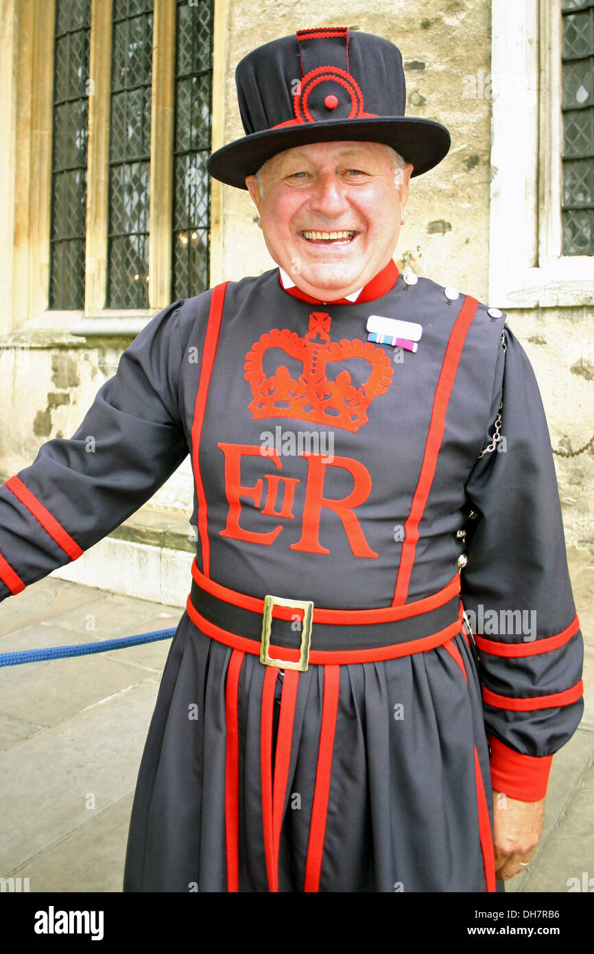 Smiling and happy Beefeater guard in the Tower of London . Stock Photo