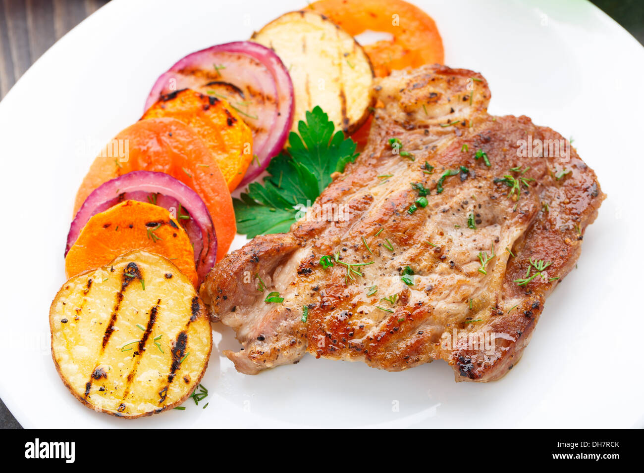 Steak with grilled vegetables on a plate Stock Photo Alamy